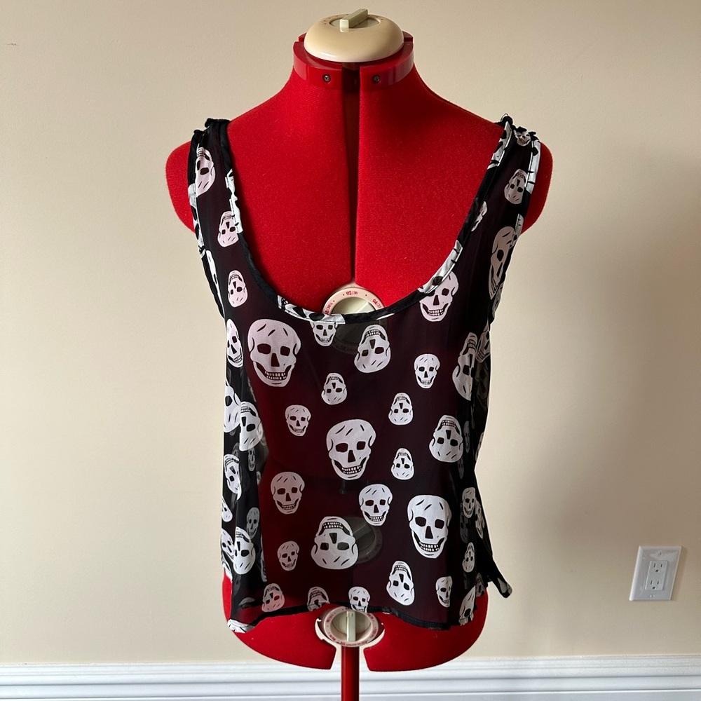 Skull motif top with lacy detail on back.